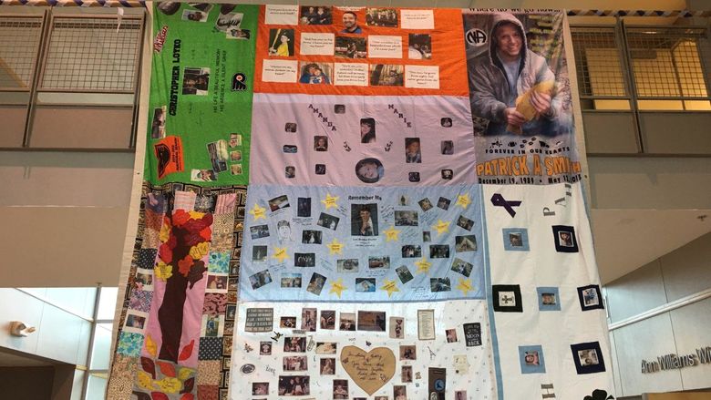 quilt hanging from upper level