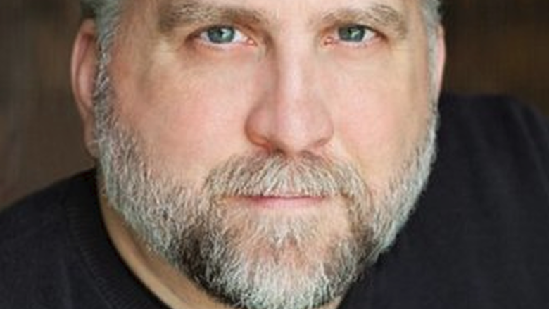 headshot of man with beard