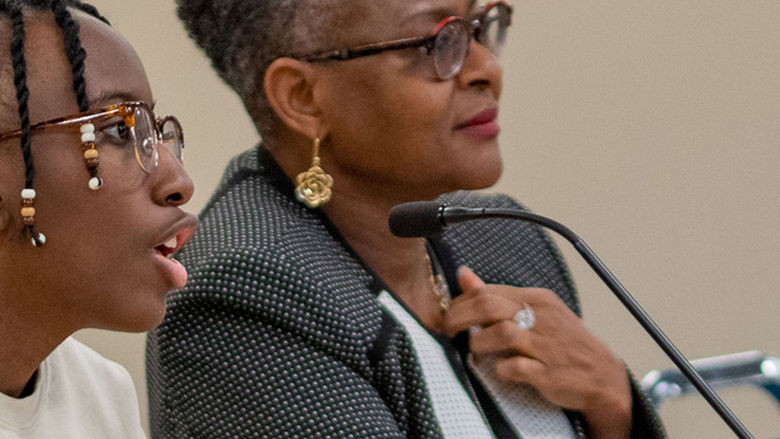 Student and Chancellor on panel