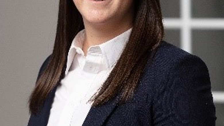 head shot of woman in suit