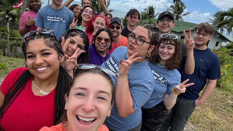 A group of students takes a selfie during a spring break trip to Puerto Rico