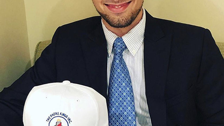 Sol Taylor holds company hat 
