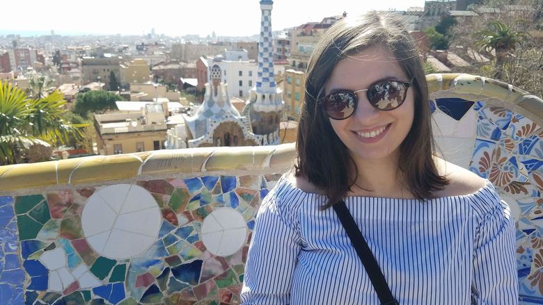 Student posed on a bench in Park Guell