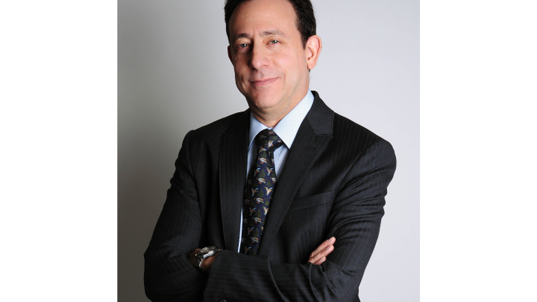 a headshot of a male author 