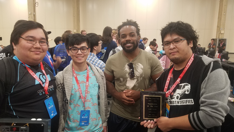 students posing with their organization of the year plaque