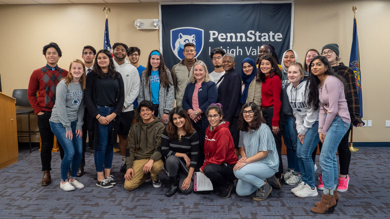 Congresswoman and chancellor posed with students