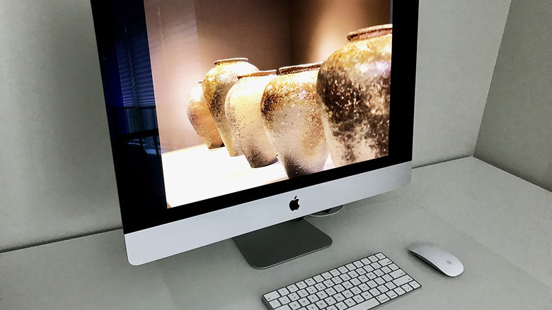 Computer screen with photo of several hand made vases