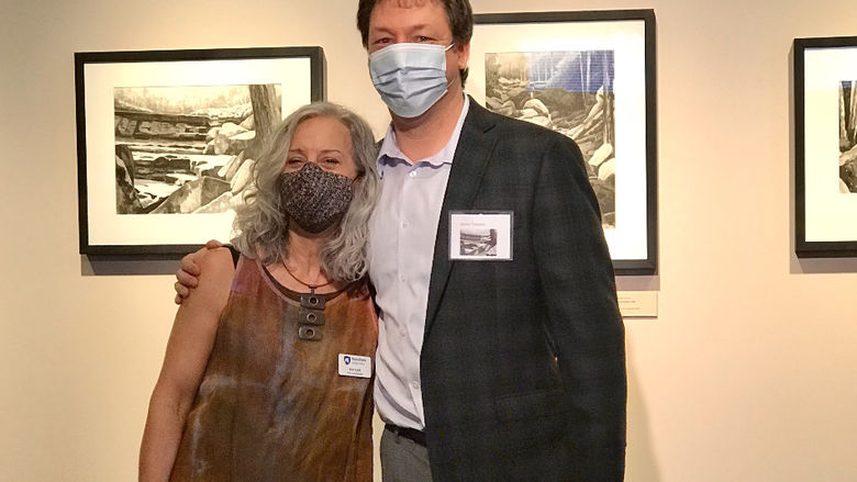 Penn State Lehigh Valley Gallery Director Ann Lalik stands with artist Jason Travers
