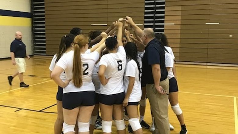 volleyball team huddled up