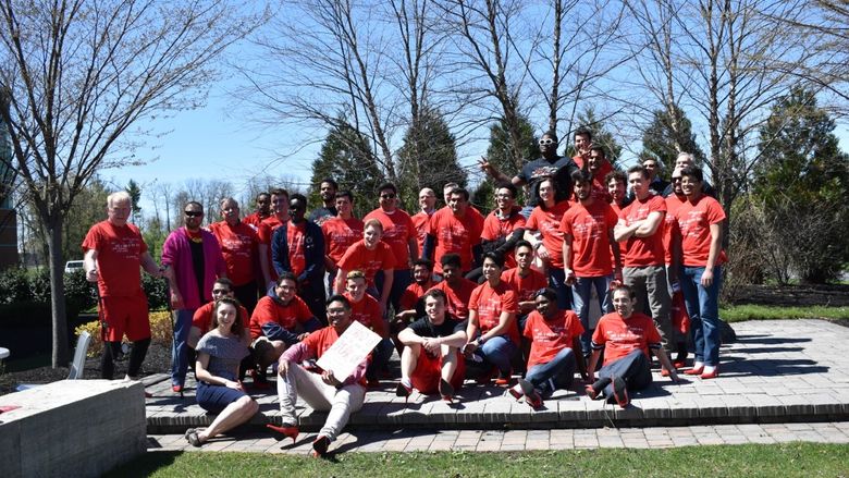 a group of men who are in red heels and red shirts
