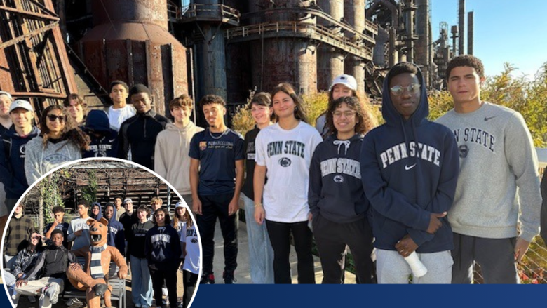 students wearing Penn State shirts smile while standing in front of Bethlehem SteelStacks