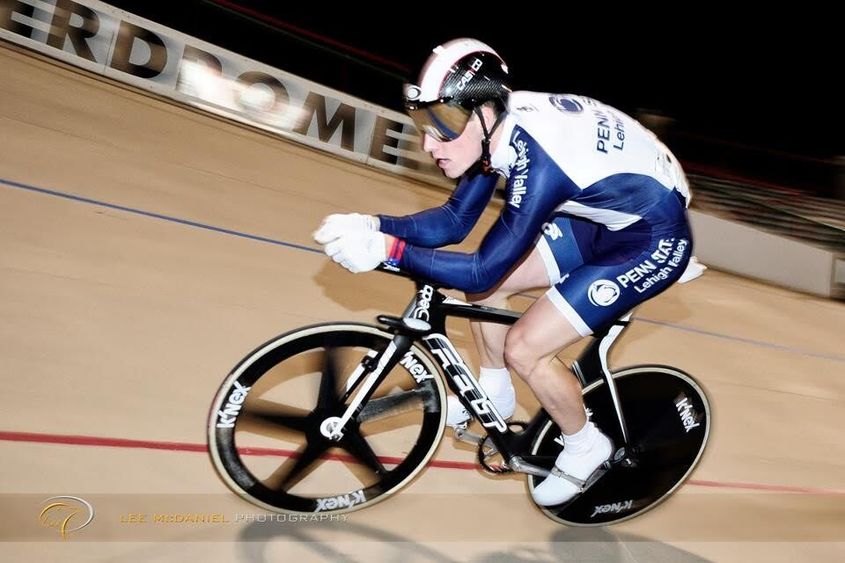 Cyclist racing on track