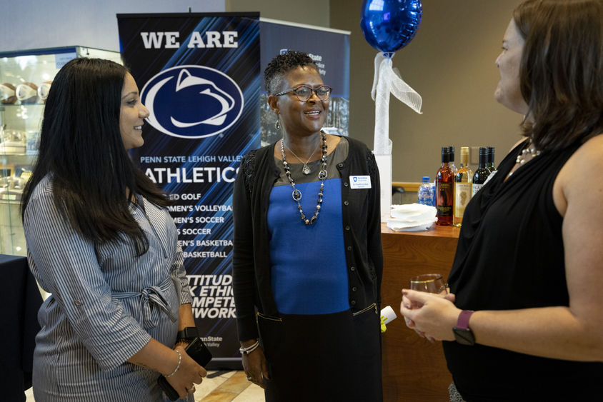 Chancellor Richardson speaking with Christina Luey and Hiba Moussa