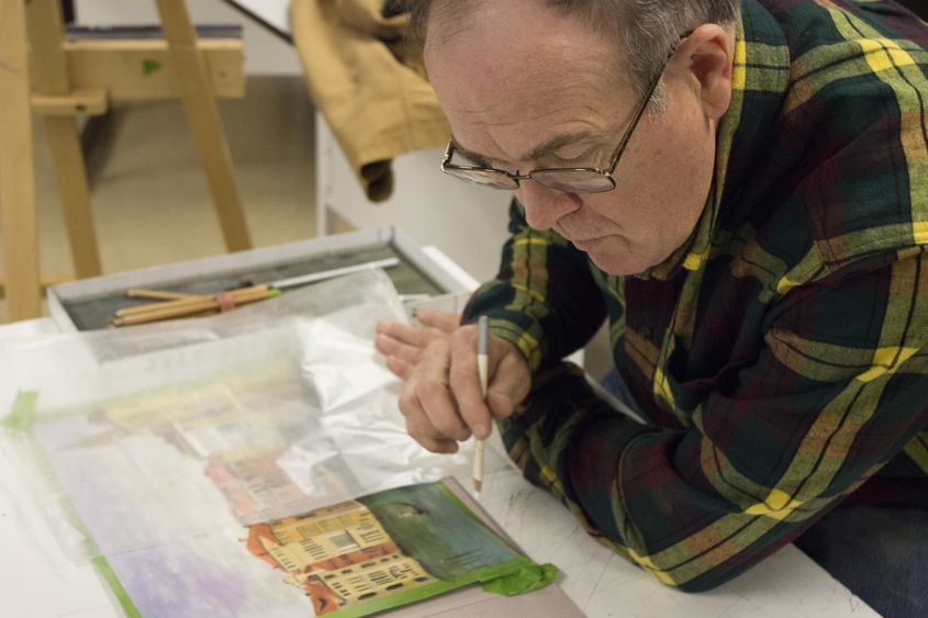 A man works on his art A man works on his art