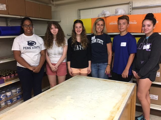 campers pose at food bank