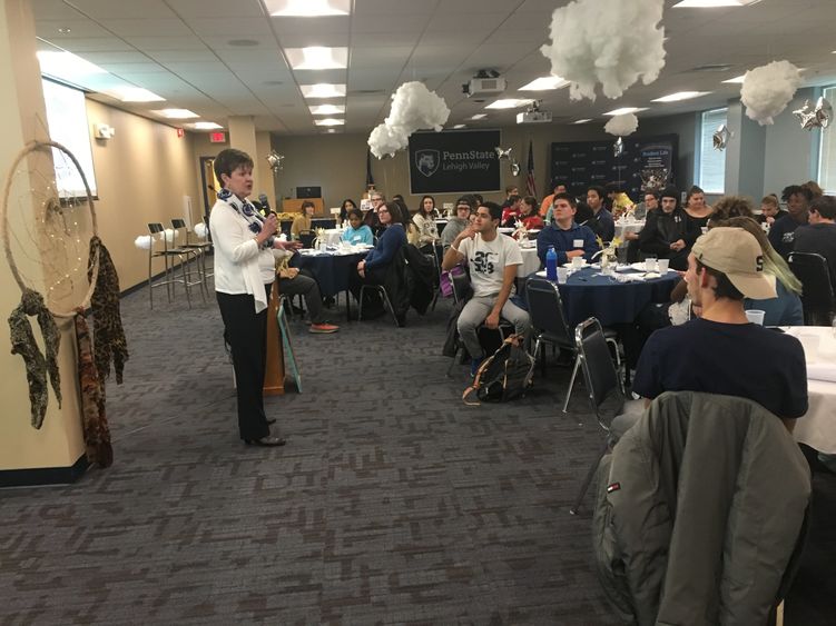 Professor presenting to a room full of students