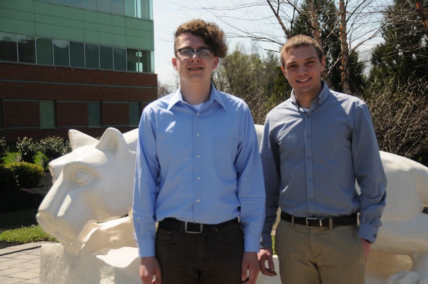 Two students in front of Lion Shrine