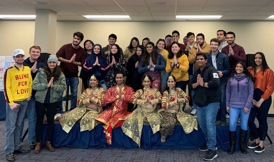 group of students and Indian dancers