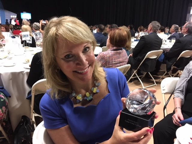 Nichola Gutgold holding a plaque