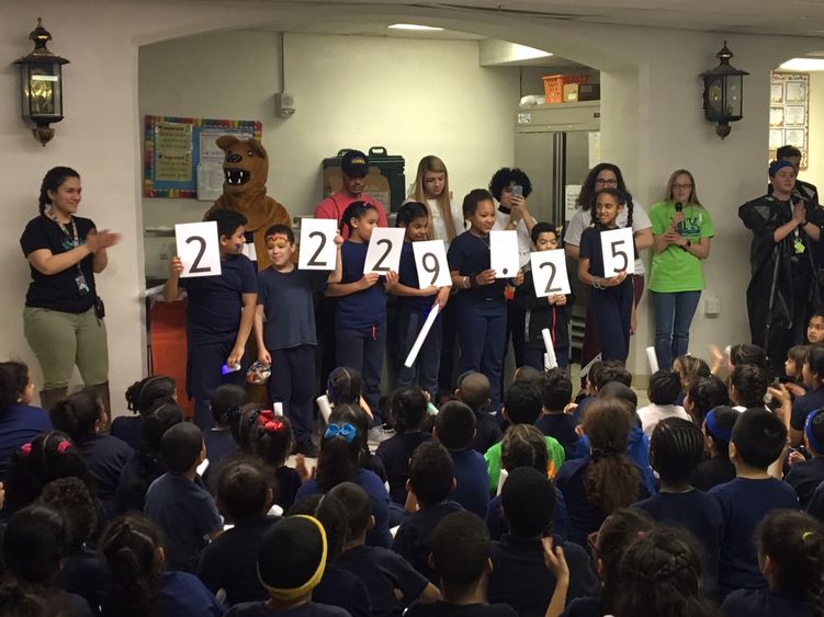 students hold up total raised by Mini-THON