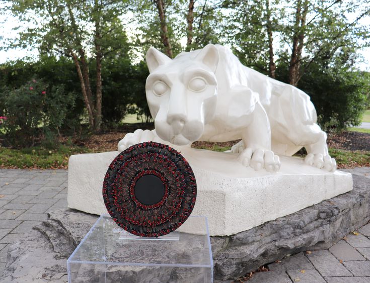 Nittany Lion Shrine with spotted lanterfly artwork in front of it