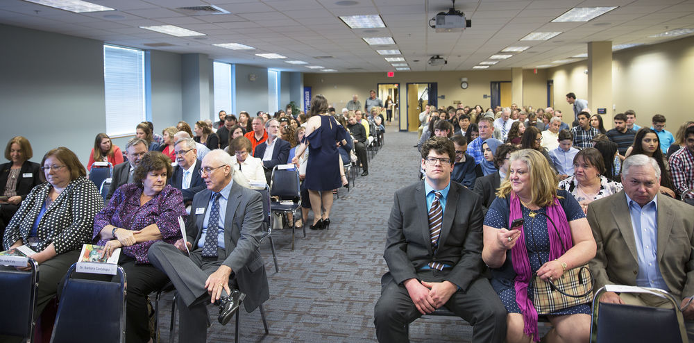 a group of people seated in an auditorium