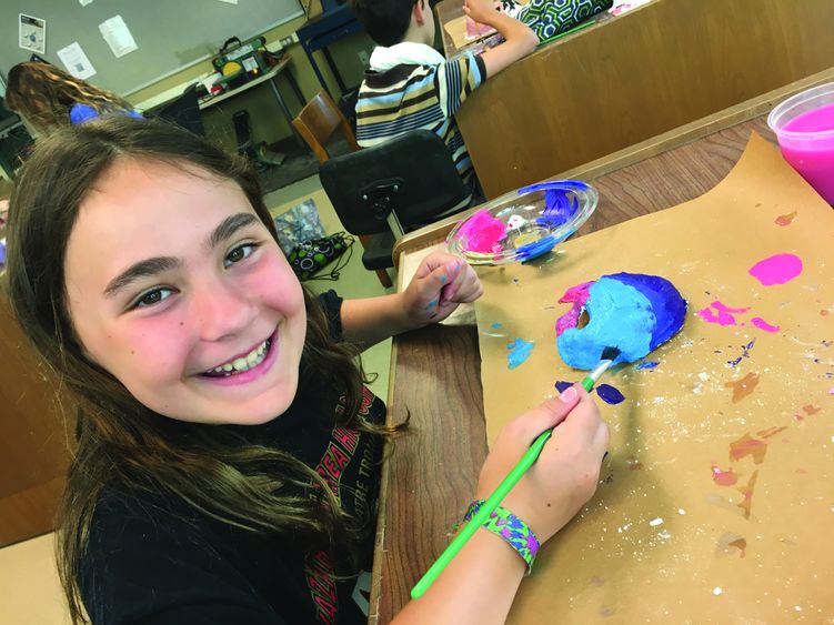 girl doing an art project