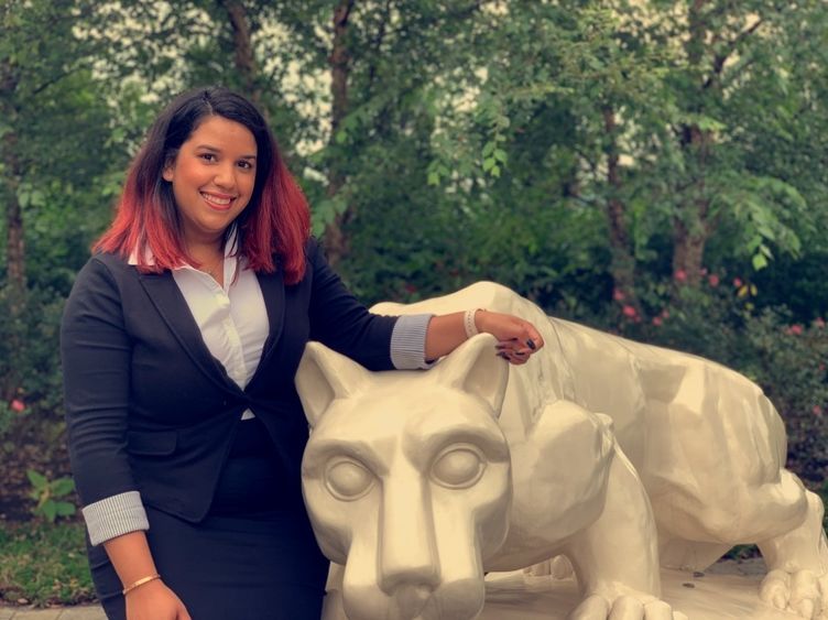 head shot of student: Fatima Alba with Nittany Lion