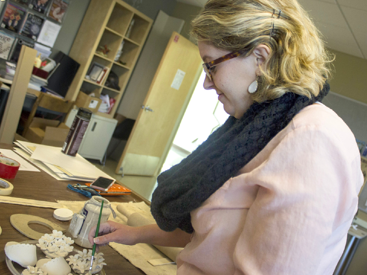 a woman painting 