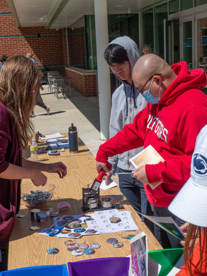 Students make buttons at Arts Fest 