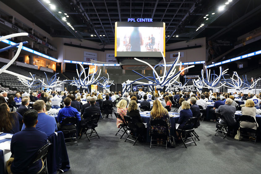 300 people seated at tables in PPL Center