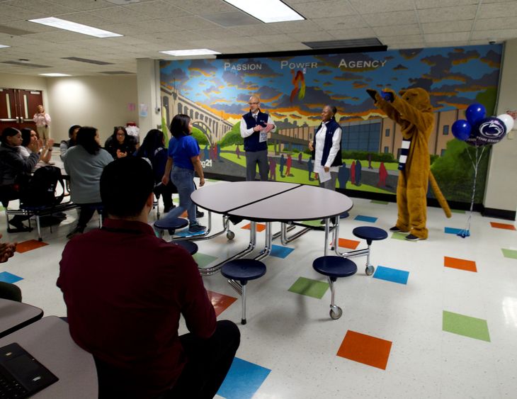 student walks to the front of cafeteria