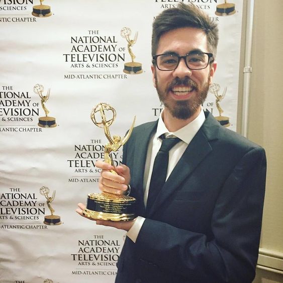 Carlo Acerra holding his Emmy