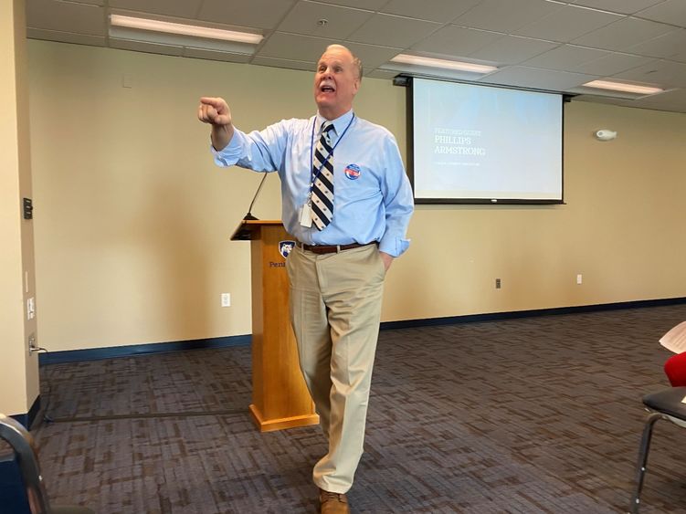 man stepping away from podium