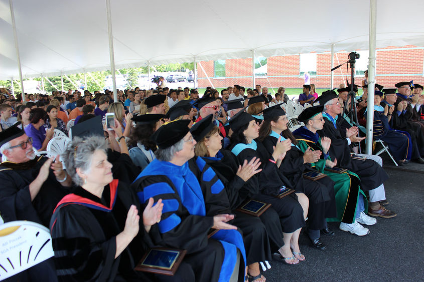 Group of faculty clap at convocation