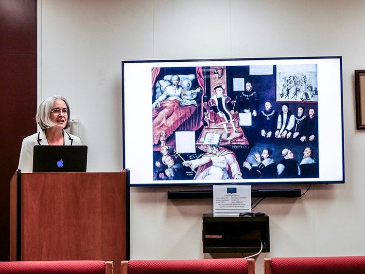 Professor presenting behind a podium