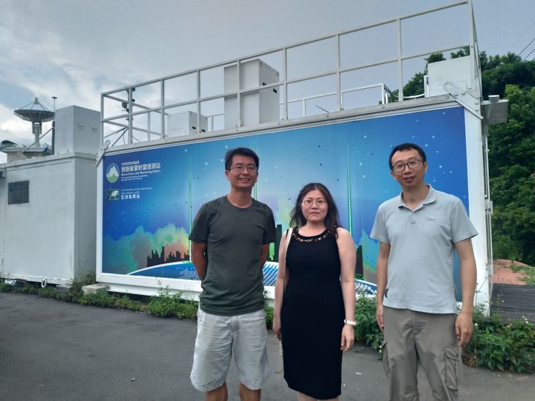 three people in front of a facility