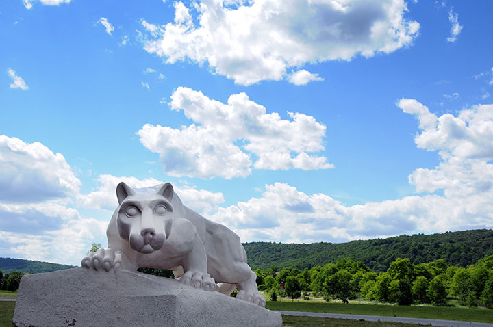 Penn Statte Lehigh Valley Lion Shrine statue with mountain and blue sky behind it.