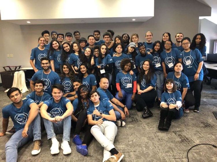 group of students in matching blue t-shirts