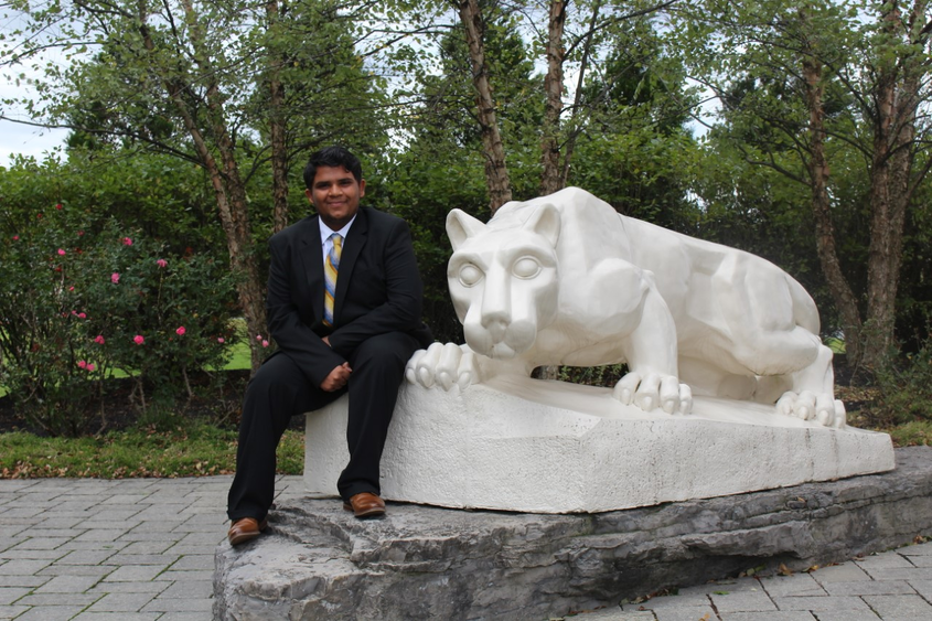 Hemil Patel in front of lion statue
