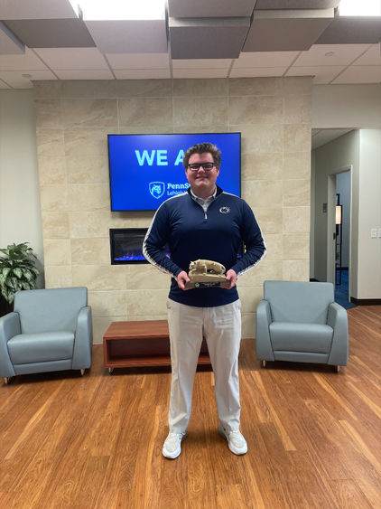 Matt Cascioli holds his CCSG award.