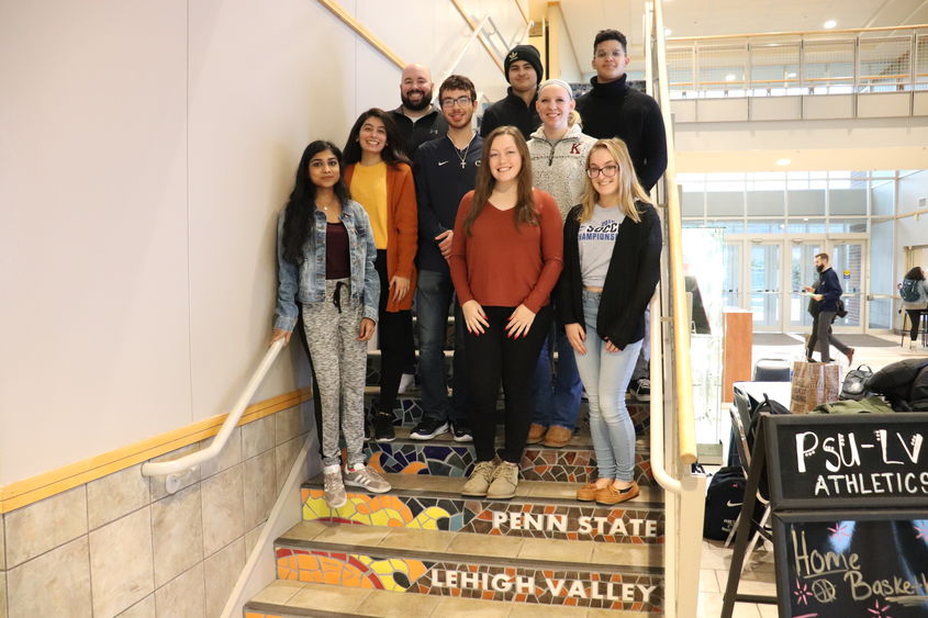 group of students and staff on steps