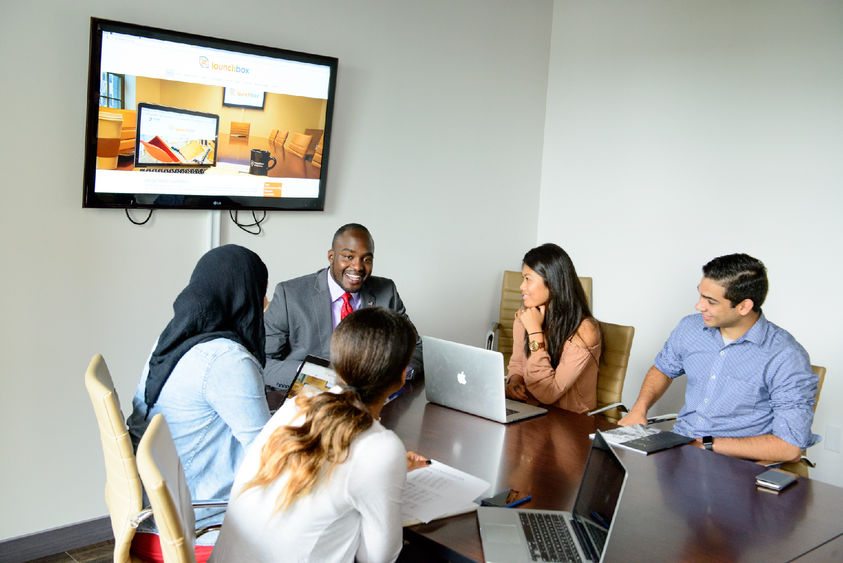 Individuals sitting around a table