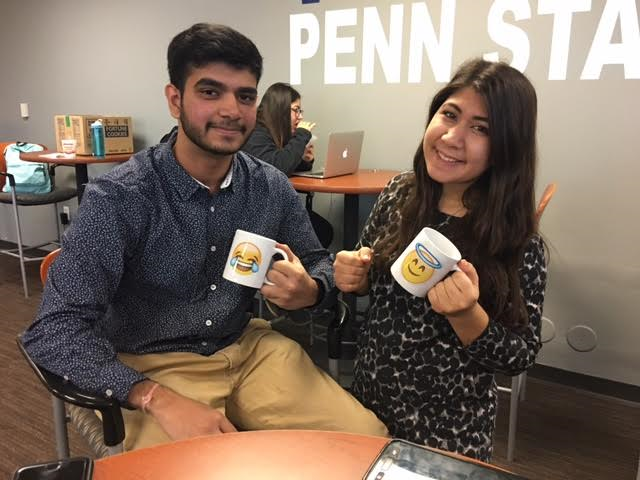 Students with their emoji mugs Students with their emoji mugs
