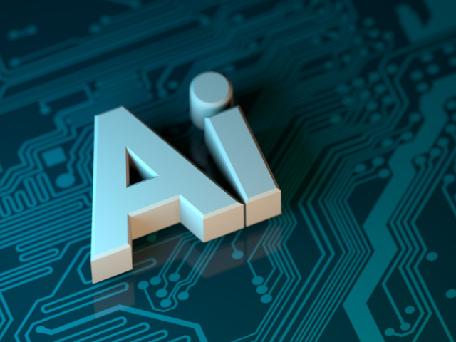 "Ai" lettering on top of computer microchip