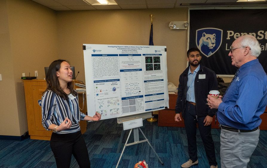 Students present research to faculty member