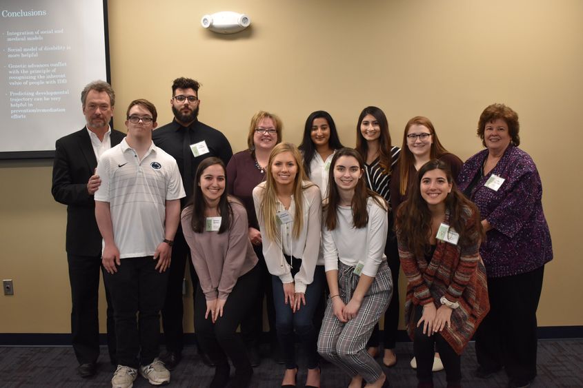 group of students, guest speaker and faculty