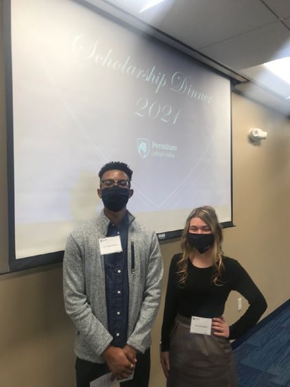 Scholarship Dinner student speakers pose against backdrop