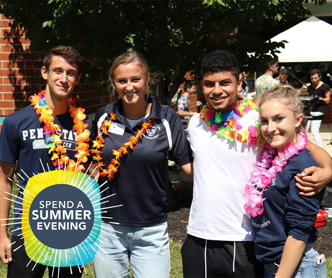 Spend A Summer Evening Four smiling students standing outside arm-in-arm on campus