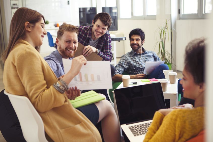 Students sit around computers Supply chain